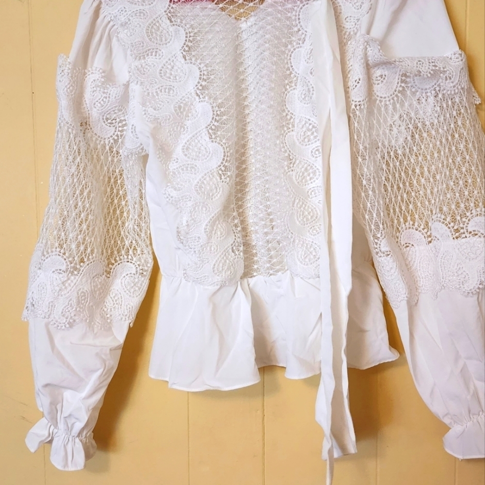 Story On white blouse size small.
